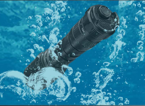 A picture of a waterproof flashlight submerged in water.