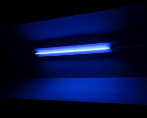 A black light that is attached to a wall.